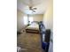 Bedroom with queen-size bed and ceiling fan at 13612 W Cypress St, Goodyear, AZ 85395