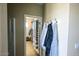 Walk-in closet with ample shelving and hanging space at 13612 W Cypress St, Goodyear, AZ 85395