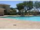 Relaxing community pool with patio furniture and umbrellas at 13612 W Cypress St, Goodyear, AZ 85395