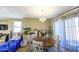 Bright dining area with wood table and chairs, and chandelier at 13612 W Cypress St, Goodyear, AZ 85395