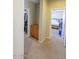 Hallway with access to bedrooms and a storage cabinet at 13612 W Cypress St, Goodyear, AZ 85395