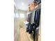 Bright laundry room with washer, dryer, shelving, and ample storage at 13612 W Cypress St, Goodyear, AZ 85395
