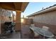 Cozy patio with seating area and grill at 13612 W Cypress St, Goodyear, AZ 85395