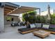 Spacious backyard with sectional sofa and wood coffee table at 1442 E Rancho Dr, Phoenix, AZ 85014