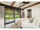Bright bedroom with sliding glass doors opening to the backyard at 1442 E Rancho Dr, Phoenix, AZ 85014