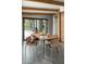 Modern dining area with large sliding glass doors and wood table at 1442 E Rancho Dr, Phoenix, AZ 85014