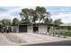 Mid-century modern home with attached garage and manicured lawn at 1442 E Rancho Dr, Phoenix, AZ 85014