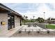 Mid-century modern home with a landscaped front yard and seating area at 1442 E Rancho Dr, Phoenix, AZ 85014