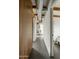 Long hallway with wood accent wall and exposed ductwork at 1442 E Rancho Dr, Phoenix, AZ 85014