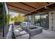 Modern patio with fire pit, seating area, and covered pergola at 1442 E Rancho Dr, Phoenix, AZ 85014