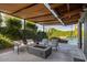 Relaxing patio with fire pit and comfortable seating at 1442 E Rancho Dr, Phoenix, AZ 85014