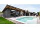 Inviting swimming pool with expansive patio and lounge chairs at 1442 E Rancho Dr, Phoenix, AZ 85014