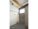 Clean and modern walk-in shower with concrete block feature wall at 1442 E Rancho Dr, Phoenix, AZ 85014