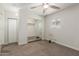 Bedroom with mirrored closet doors, ceiling fan, neutral carpet and bright natural light at 14846 N 29Th Ave, Phoenix, AZ 85053