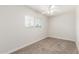 Cozy bedroom with carpeted floors, a ceiling fan, and a window with natural light at 14846 N 29Th Ave, Phoenix, AZ 85053