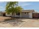 Wide driveway to a covered front entrance on a single story home in an arid climate at 14846 N 29Th Ave, Phoenix, AZ 85053