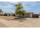 Charming single-story home featuring a low maintenance front yard, mature shade tree and wide driveway at 14846 N 29Th Ave, Phoenix, AZ 85053