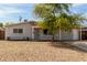 Charming single-story home featuring a well-maintained front yard with mature tree and inviting entrance at 14846 N 29Th Ave, Phoenix, AZ 85053