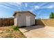 Detached garage with a concrete patio extension and block wall at 14846 N 29Th Ave, Phoenix, AZ 85053
