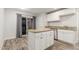 Modern kitchen showcasing a center island with sink, granite counters, and stainless appliances at 14846 N 29Th Ave, Phoenix, AZ 85053