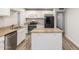 Bright kitchen featuring granite countertops, stainless steel appliances and a center island at 14846 N 29Th Ave, Phoenix, AZ 85053