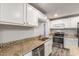 Bright kitchen featuring stainless steel appliances, granite countertops and ample storage space at 14846 N 29Th Ave, Phoenix, AZ 85053