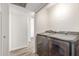 Convenient laundry room with modern washer and dryer units and hard surface flooring at 14846 N 29Th Ave, Phoenix, AZ 85053