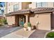 Building entrance with clear address number and attractive landscaping at 14950 W Mountain View Blvd # 3209, Surprise, AZ 85374