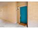 Teal-colored building entrance with a welcoming doormat at 14950 W Mountain View Blvd # 3209, Surprise, AZ 85374