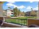 Community view showcasing lush green lawns, palm trees, and well-maintained apartment buildings at 14950 W Mountain View Blvd # 3209, Surprise, AZ 85374