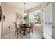 Bright dining area with a table and chairs near a window at 14950 W Mountain View Blvd # 3209, Surprise, AZ 85374