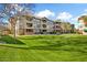Attractive exterior of the apartment building, set against a backdrop of manicured lawns at 14950 W Mountain View Blvd # 3209, Surprise, AZ 85374
