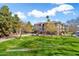 Exterior view of an apartment building with attractive landscaping and a well-kept lawn at 14950 W Mountain View Blvd # 3209, Surprise, AZ 85374