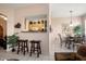 Open kitchen with a breakfast bar and ample cabinet space at 14950 W Mountain View Blvd # 3209, Surprise, AZ 85374