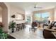 Bright living room with recessed lighting, tile floors, and comfy seating at 14950 W Mountain View Blvd # 3209, Surprise, AZ 85374