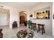 Living area showcasing an open floor plan and kitchen views at 14950 W Mountain View Blvd # 3209, Surprise, AZ 85374
