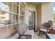 Relaxing patio with wicker furniture and sliding glass door at 14950 W Mountain View Blvd # 3209, Surprise, AZ 85374