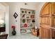 Built-in shelving with decorative items and a smart home device at 14950 W Mountain View Blvd # 3209, Surprise, AZ 85374