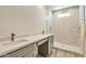 Modern bathroom with double vanity, large shower, and marble tile at 15200 S Diablo Rd, Arizona City, AZ 85123
