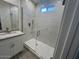 Modern bathroom with a glass shower enclosure, white subway tile, and granite countertop at 15200 S Diablo Rd, Arizona City, AZ 85123