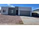 New modern home with two-tone exterior and two-car garage at 15200 S Diablo Rd, Arizona City, AZ 85123