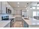 Modern kitchen with gray cabinets, island and stainless steel appliances at 15200 S Diablo Rd, Arizona City, AZ 85123