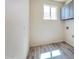 Laundry room with gray cabinets and vinyl wood flooring at 15200 S Diablo Rd, Arizona City, AZ 85123