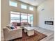 Bright living room with fireplace and sliding glass doors at 15200 S Diablo Rd, Arizona City, AZ 85123