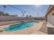 Inviting kidney-shaped pool with diving board in a large backyard at 16245 N 43Rd Dr, Glendale, AZ 85306