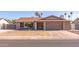 Single-story house with a two-car garage and a well-maintained lawn at 16245 N 43Rd Dr, Glendale, AZ 85306