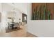 Elegant dining area with a chic chandelier and ample seating at 16442 N 58Th St, Scottsdale, AZ 85254