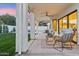 Evening view of covered patio with comfortable seating at 16442 N 58Th St, Scottsdale, AZ 85254