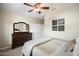 Spacious bedroom with dresser and closet, offering a peaceful retreat at 1757 E Saltsage Dr, Phoenix, AZ 85048