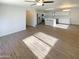 Modern kitchen with stainless steel appliances and white cabinetry at 17623 W Watson Ln, Surprise, AZ 85388